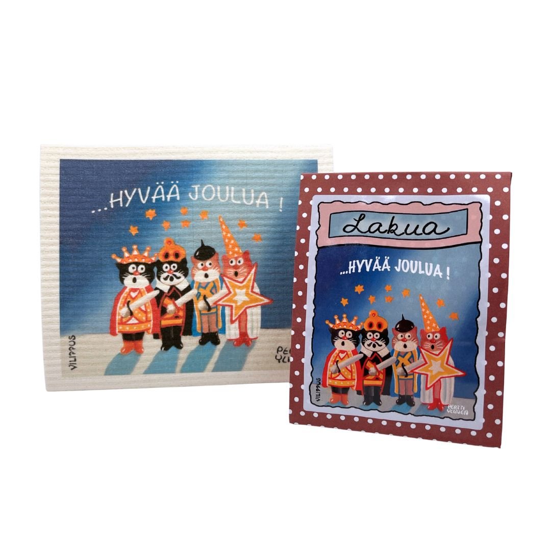 Kotimainen joululahja, joka sisältää kotimaista lakritsia ja tiskirätin, joissa kuvitus kissoista tiernapoikina, sekä teksti "hyvää joulua!"
