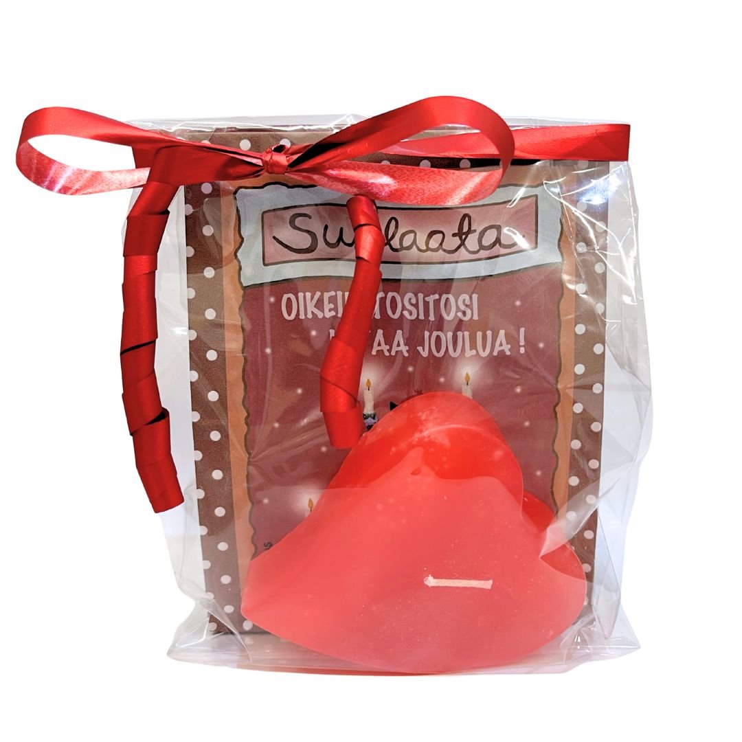 Paperipussissa Vilippus-suklaata, jonka etiketissä kissakuvitus ja teksti "Oikein tositosi kivaa joulua", sekä kotimainen joulunpunainen sydänkynttilä
