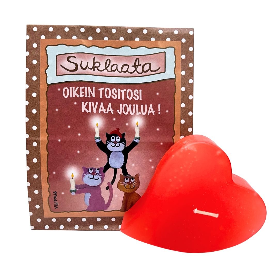 Paperipussissa Vilippus-suklaata, jonka etiketissä kissakuvitus ja teksti "Oikein tositosi kivaa joulua", sekä kotimainen joulunpunainen sydänkynttilä