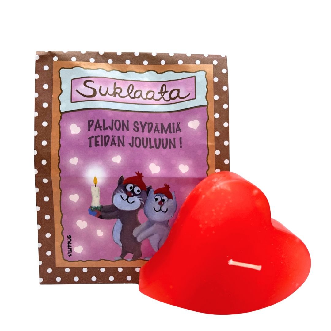 Kotimainen sydänkynttilä ja paperinen Vilippus-suklaapussi, jossa kuvituksena kissat pitämässä kynttilää, sekä teksti "Paljon sydämiä teidän jouluun!"