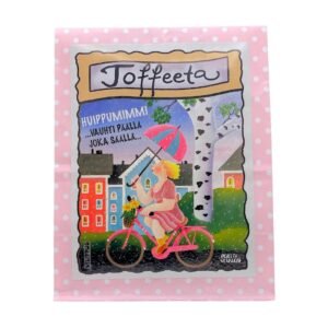 Vaaleanpunainen paperinen toffeepussi, jossa kuvitus sateella pyöräilevästä naisesta, sekä teksti "huippumimmi - vauhti päällä joka säällä!"