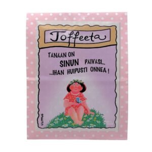Kermatoffee pakattuna paperipussiin, jossa kuvitus kukkaniityllä istuvasta naisesta, sekä teksti "Tänään on sinun päiväsi, ihan huipusti onnea!"